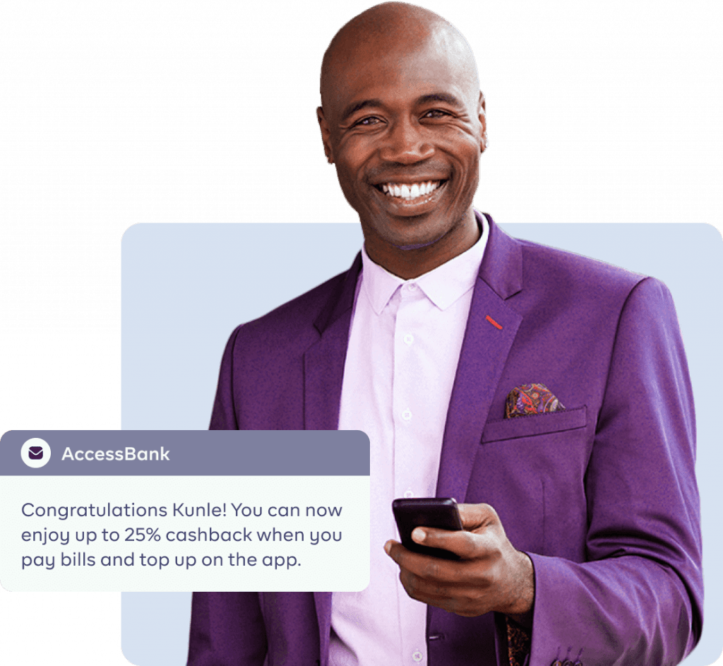 An image of a man receiving a message from his bank smiling